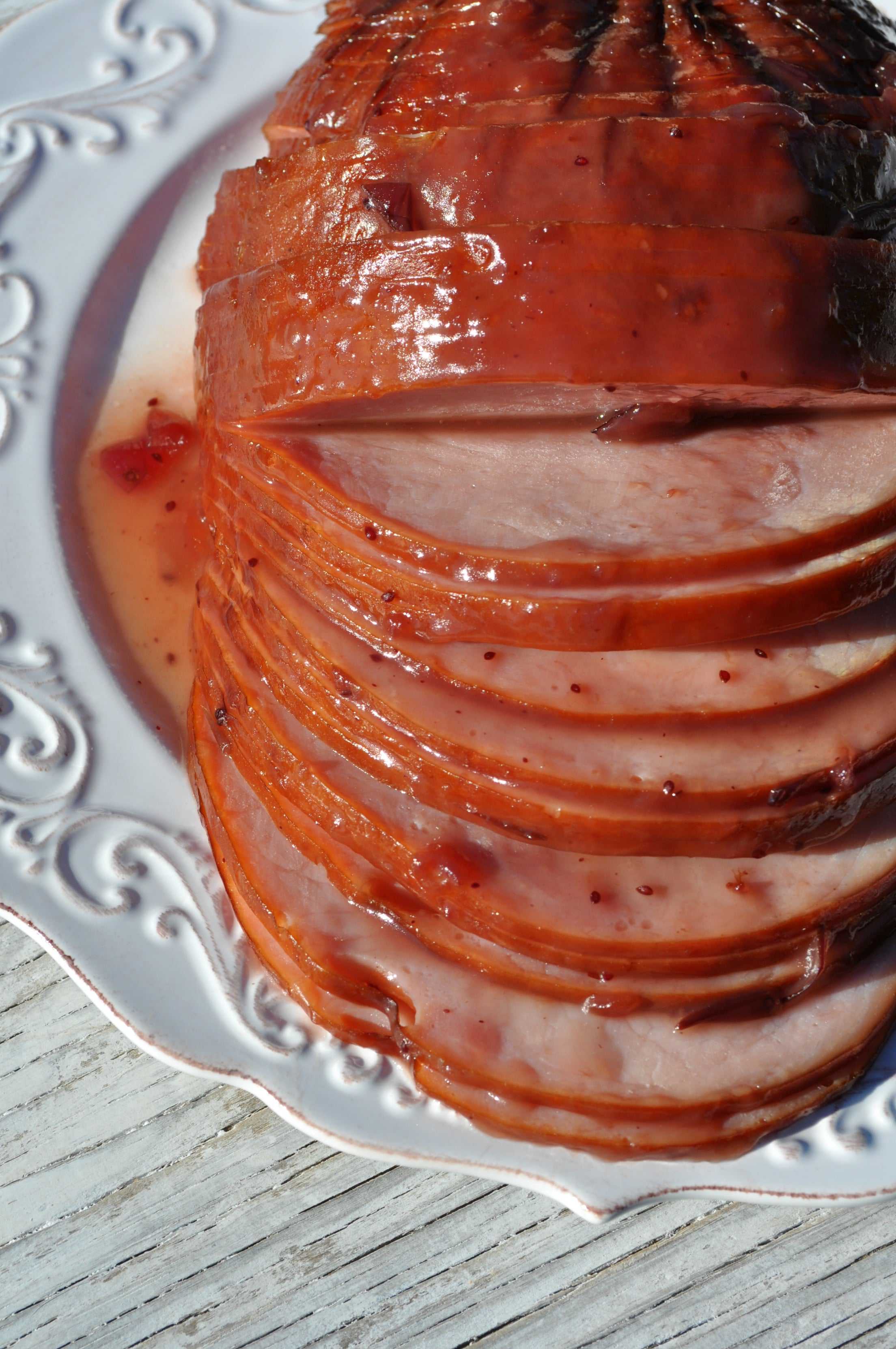 Slow Cooker Cranberry Raspberry Glazed Ham - The Seasoned Mom