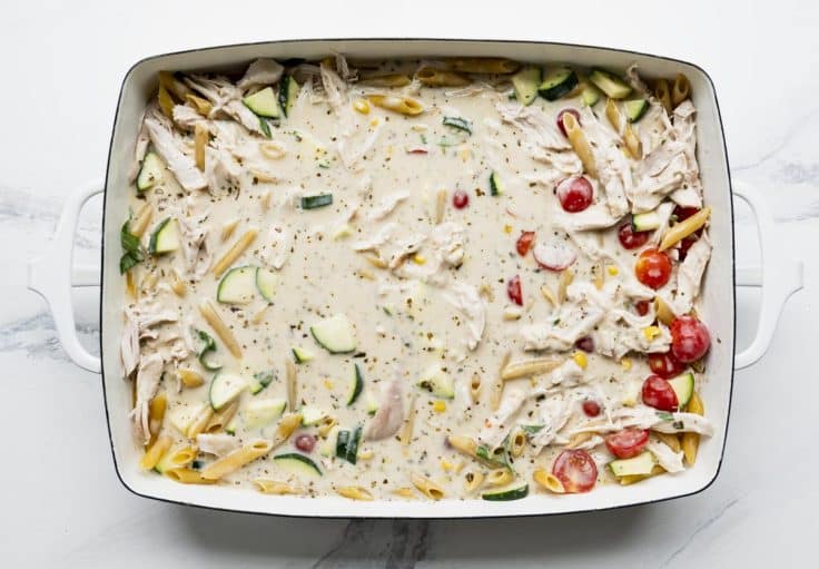 Overhead image of a pan of dump and bake summer pasta before it goes in the oven.