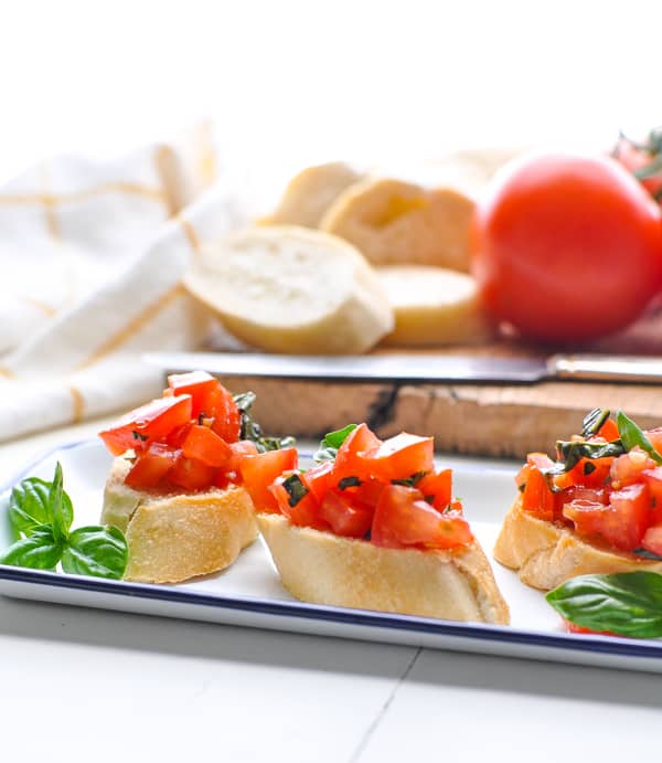 A tray of fresh tomato bruschetta is an easy summer appetizer recipe!
