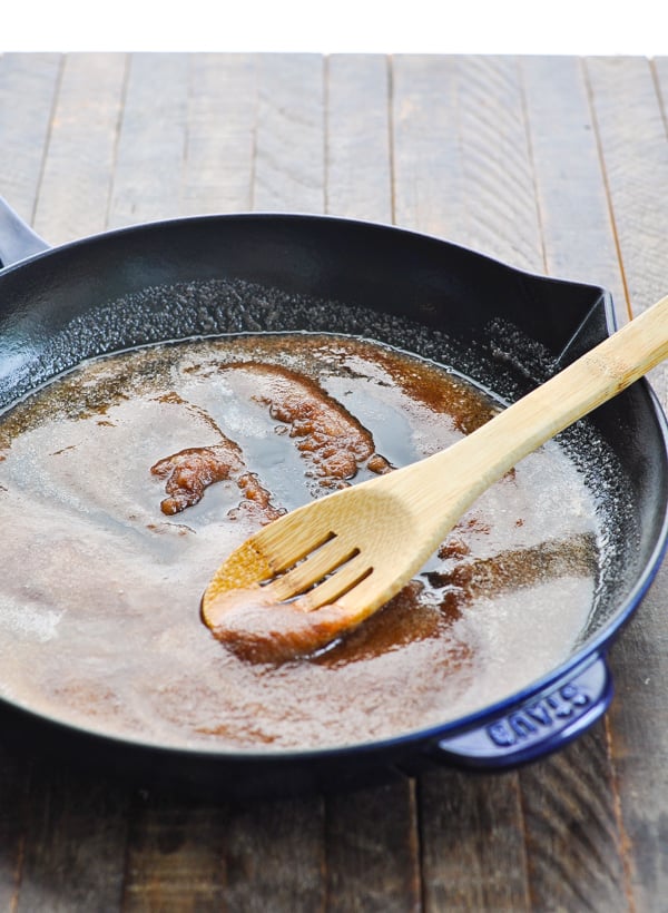 Butter sugar and cinnamon in a cast iron skillet