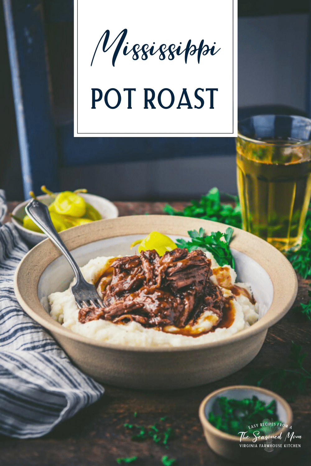 Side shot of mississippi pot roast on a dinner table with text title overlay