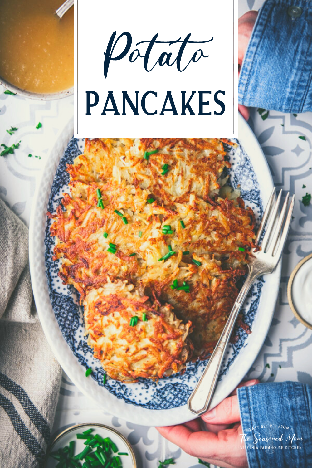 Hands holding a tray of potato pancakes with text title overlay