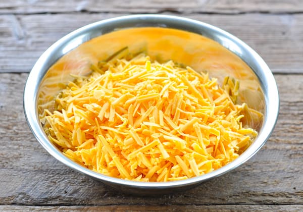 Grated cheddar in a large bowl