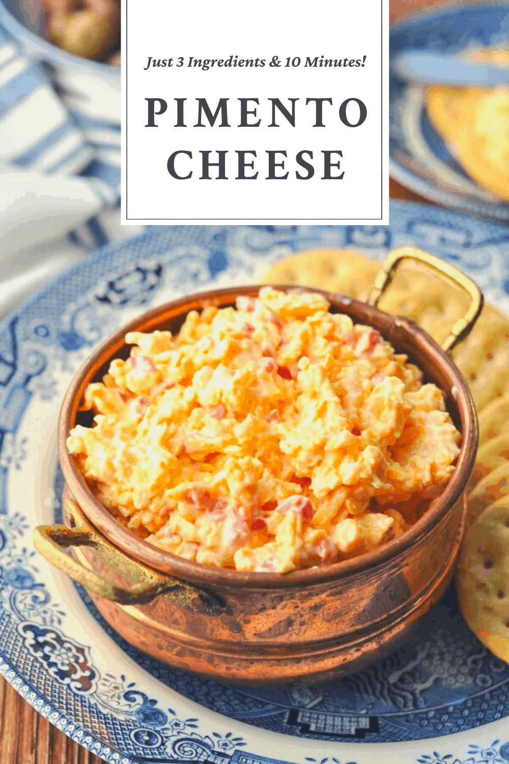 Bowl of pimento cheese with a text title on top