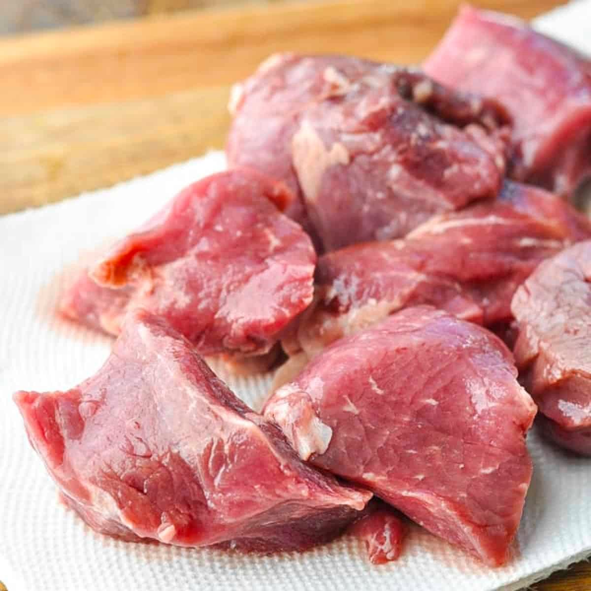 Raw steak tips.