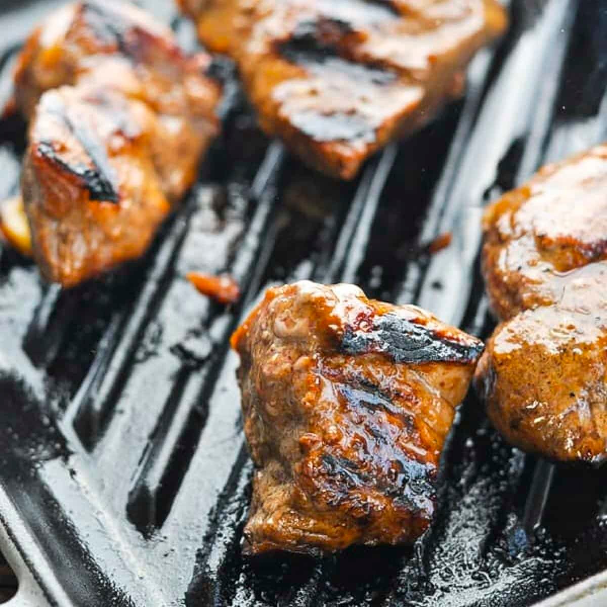 The best steak tips recipe on a cast iron grill pan.