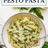 Pesto pasta with homemade pesto sauce and text title box at top.