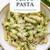 Pesto pasta with homemade pesto sauce and text title overlay.