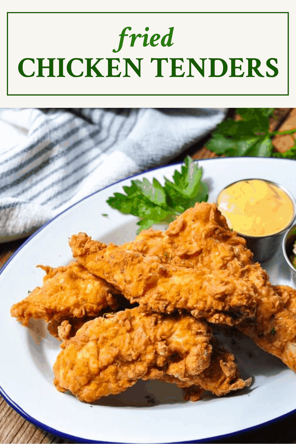 Fried chicken tenders on a white platter with a text title box at the top