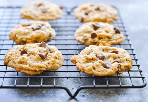 Oatmeal chocolate chip cookies cooling on a wire rack