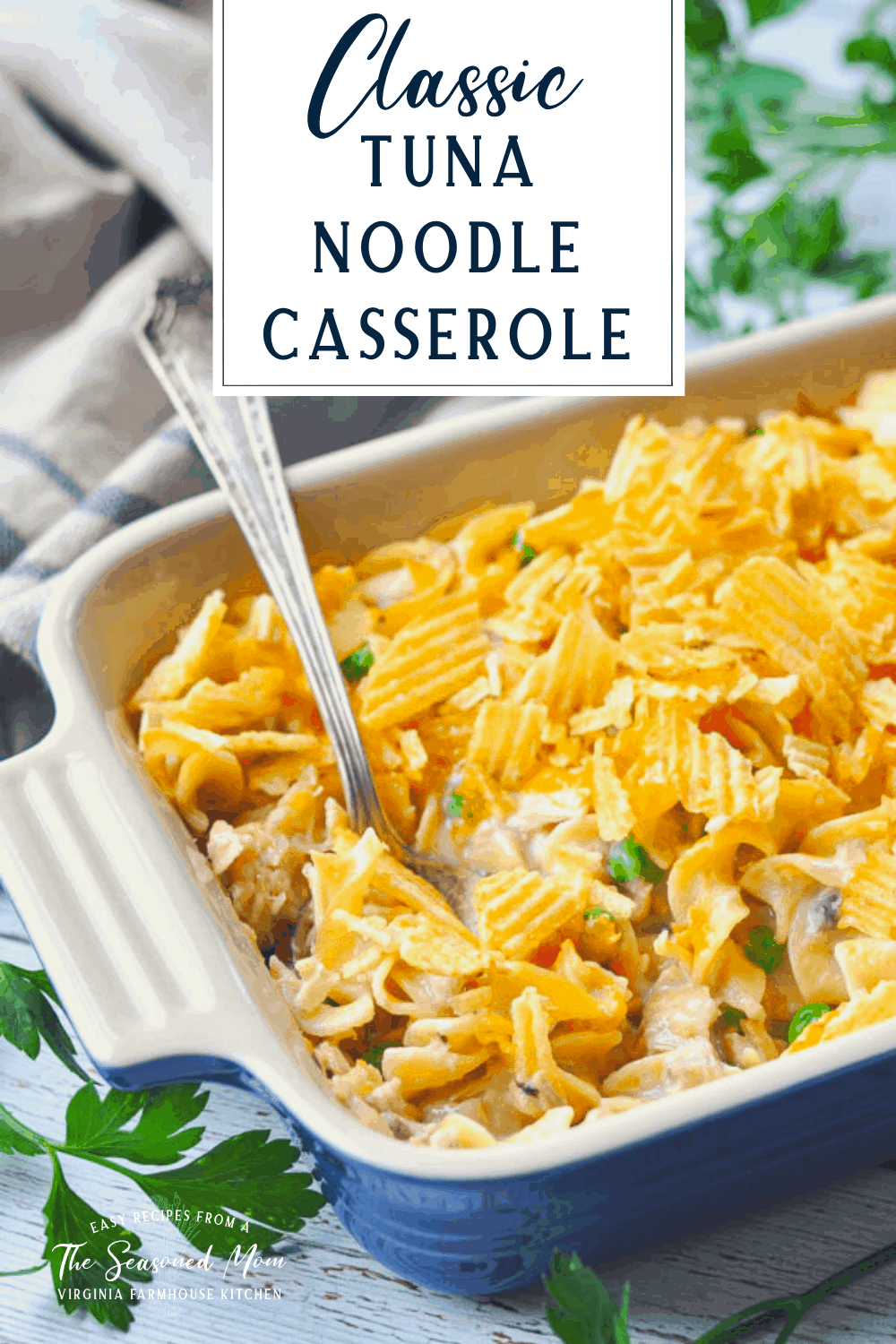 Side shot of a blue dish full of campbells tuna noodle casserole with a text title box at the top