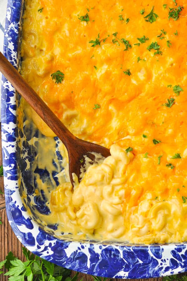 Overhead image of a casserole dish full of creamy baked mac and cheese