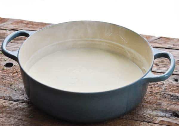 Pot of milk and cream for mac and cheese sauce