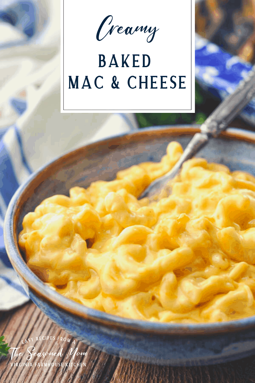 Creamy baked mac and cheese recipe served in a blue bowl with text title box at top