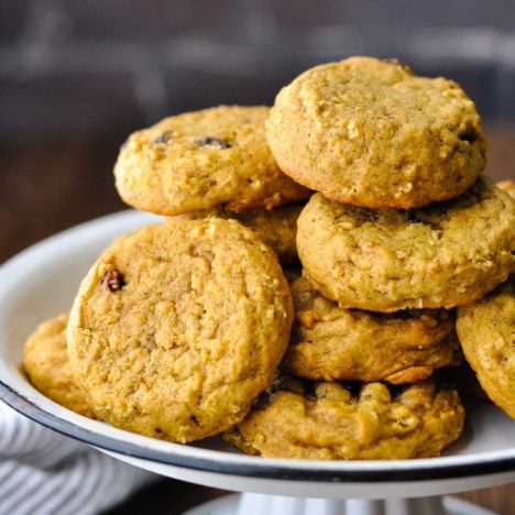 Square side shot of pumpkin oatmeal cookies on a platter.