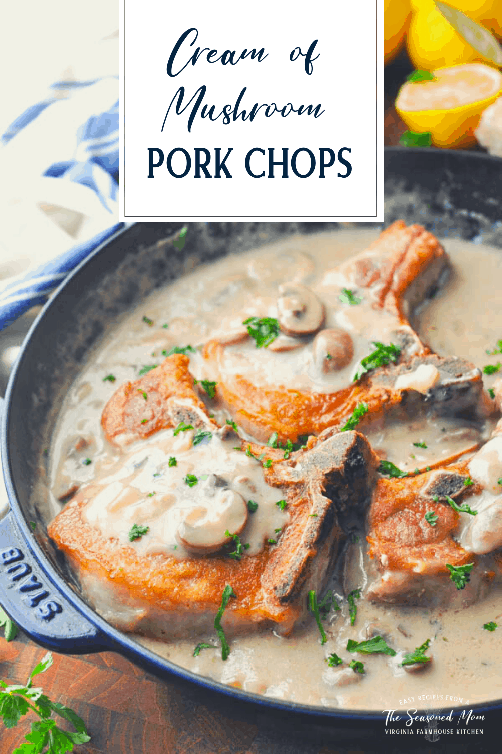 Side shot of a pan of stovetop pork chops with creamy mushroom sauce and text title box at top