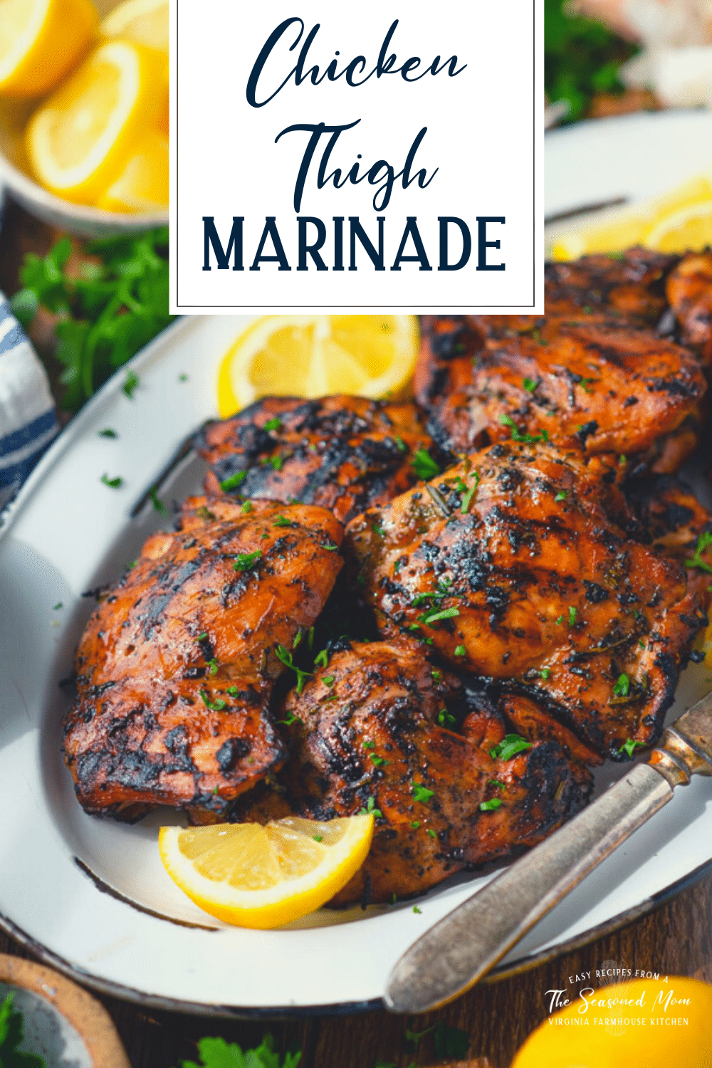 Side shot of a tray of chicken thigh marinade with text title overlay