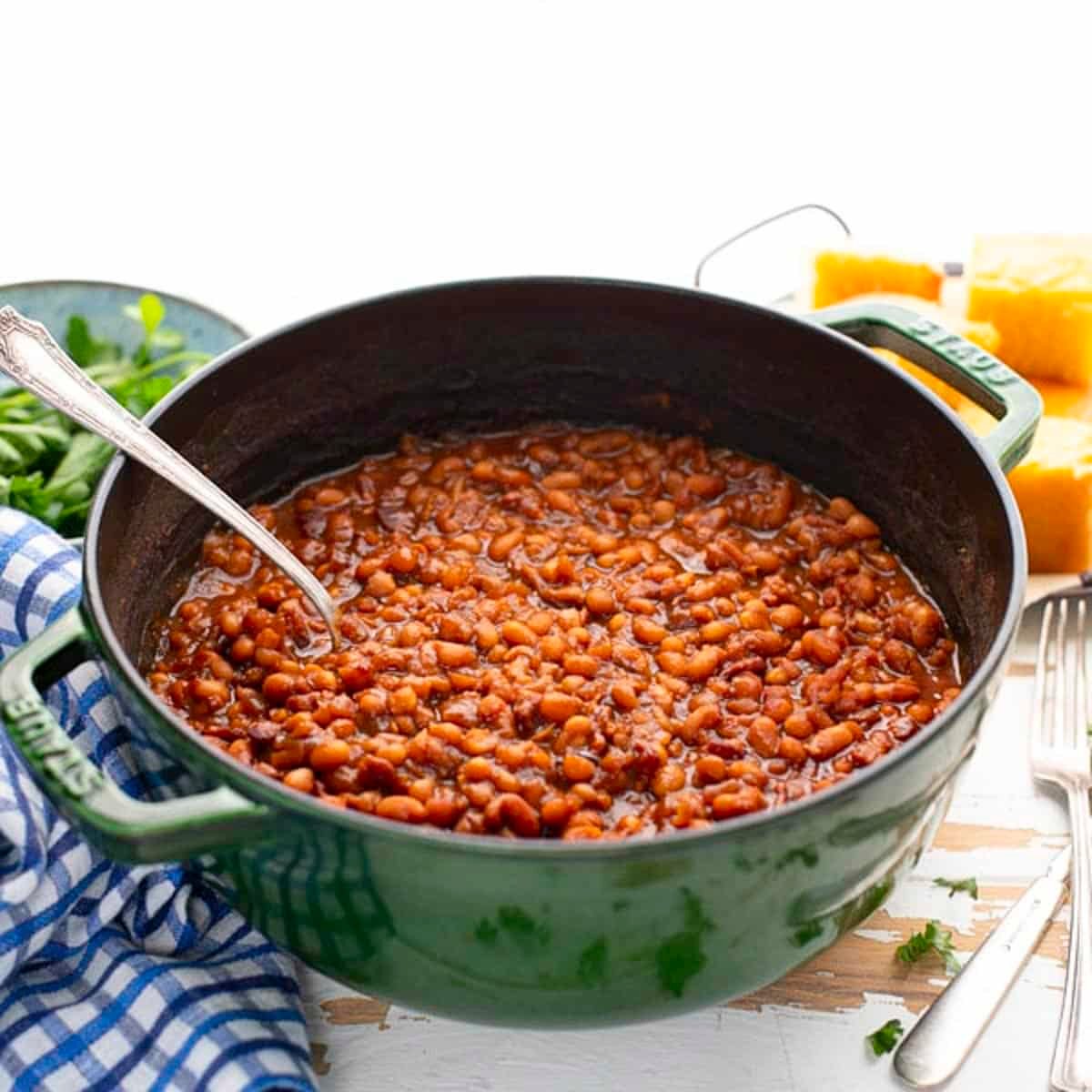 Square side shot of a pot of old fashioned homemade baked beans recipe.