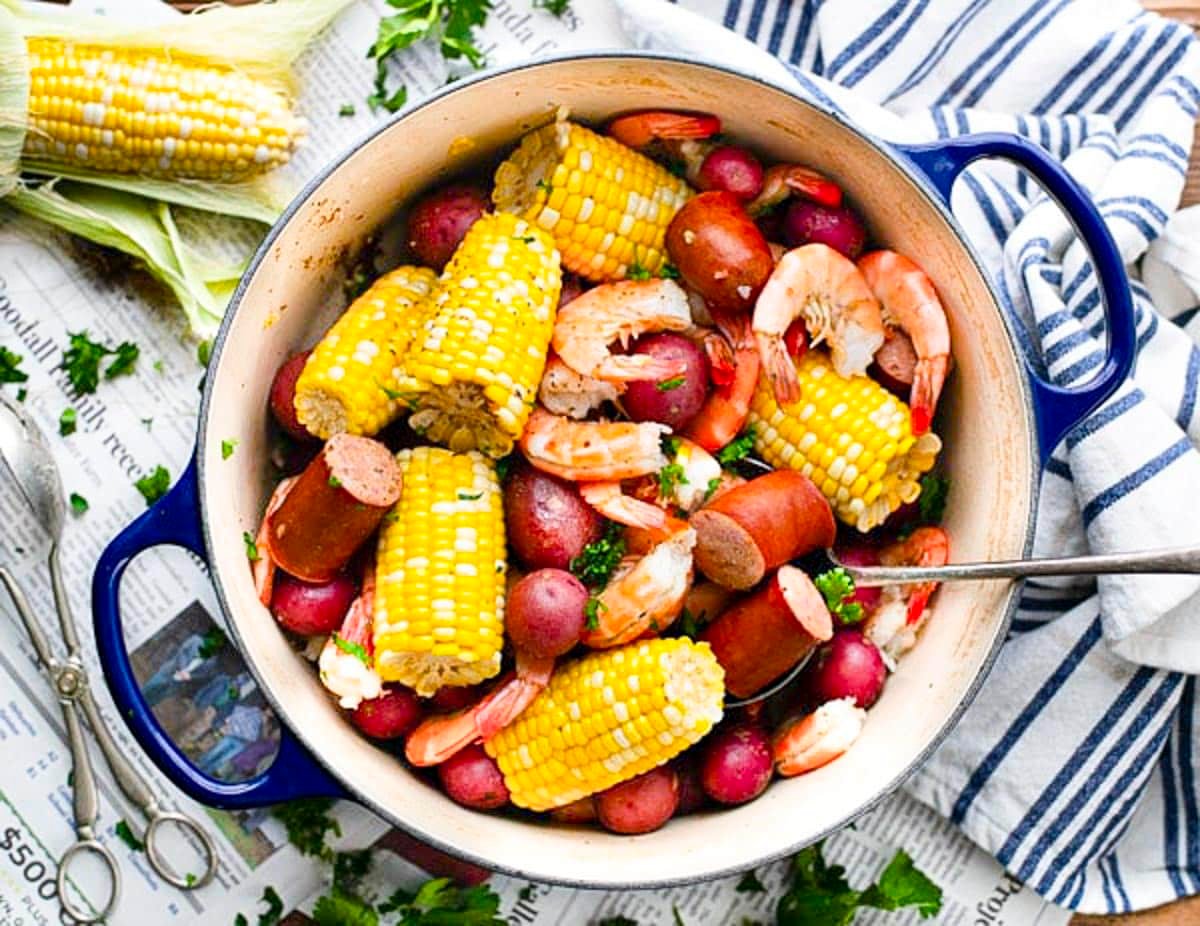 Horizontal overhead image of a pot of frogmore stew.