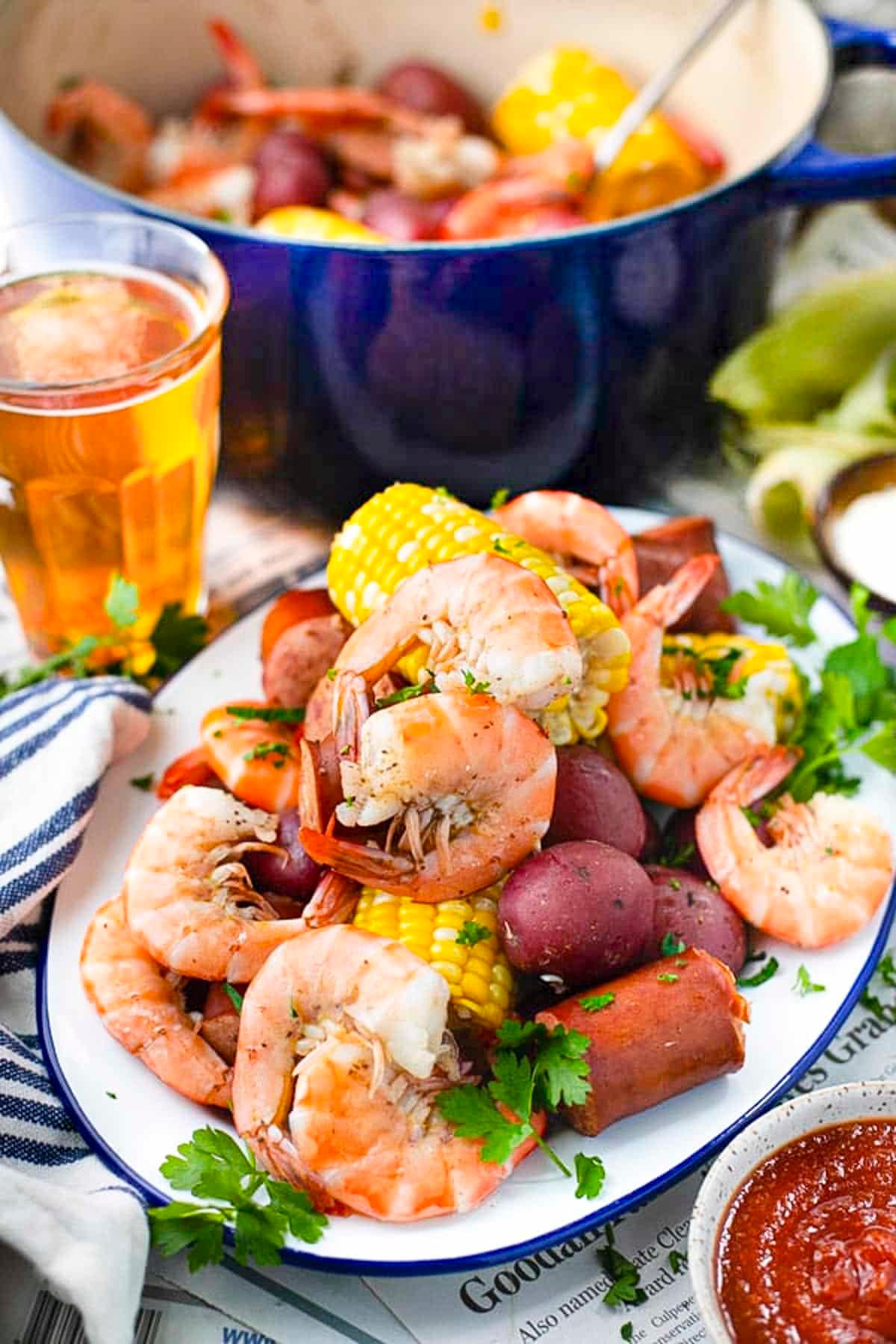 Frogmore stew served on a blue and white enamelware platter.