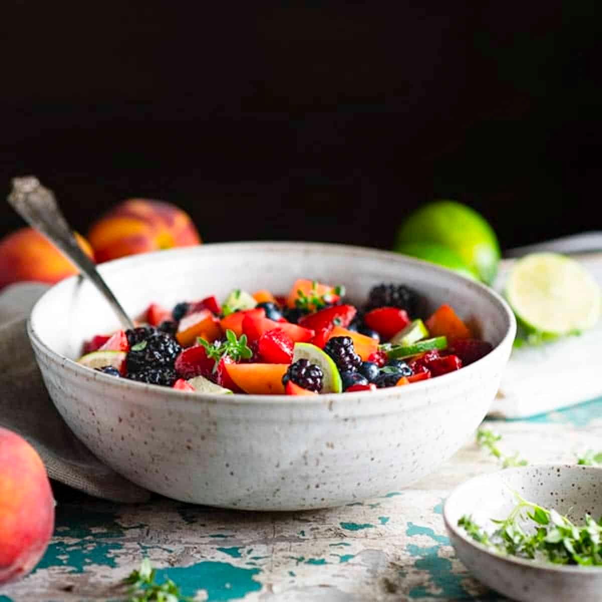 Square side shot of a bowl of easy fruit salad with vanilla pudding.