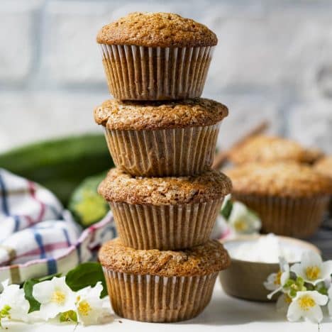 Square front shot of a stack of easy zucchini bread muffins.