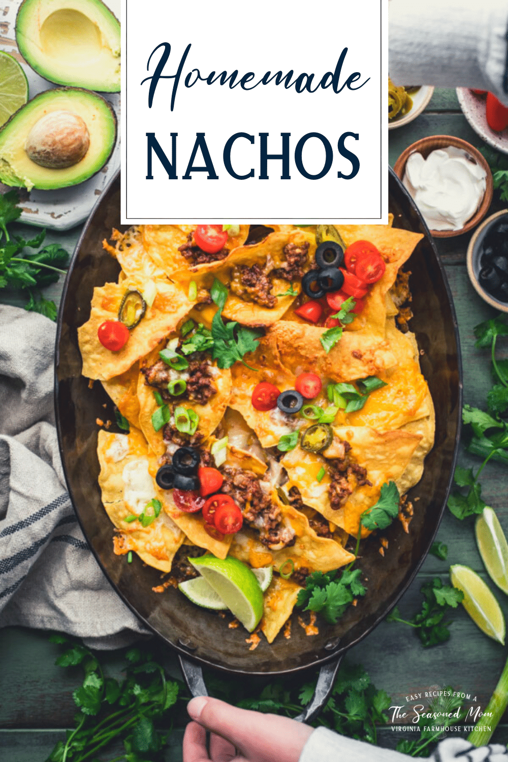 Overhead shot of homemade nachos with ground beef and text title overlay