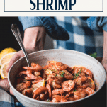Hands holding a bowl of garlic butter shrimp with text title overlay