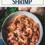 Overhead shot of lemon garlic butter shrimp with text title box at top