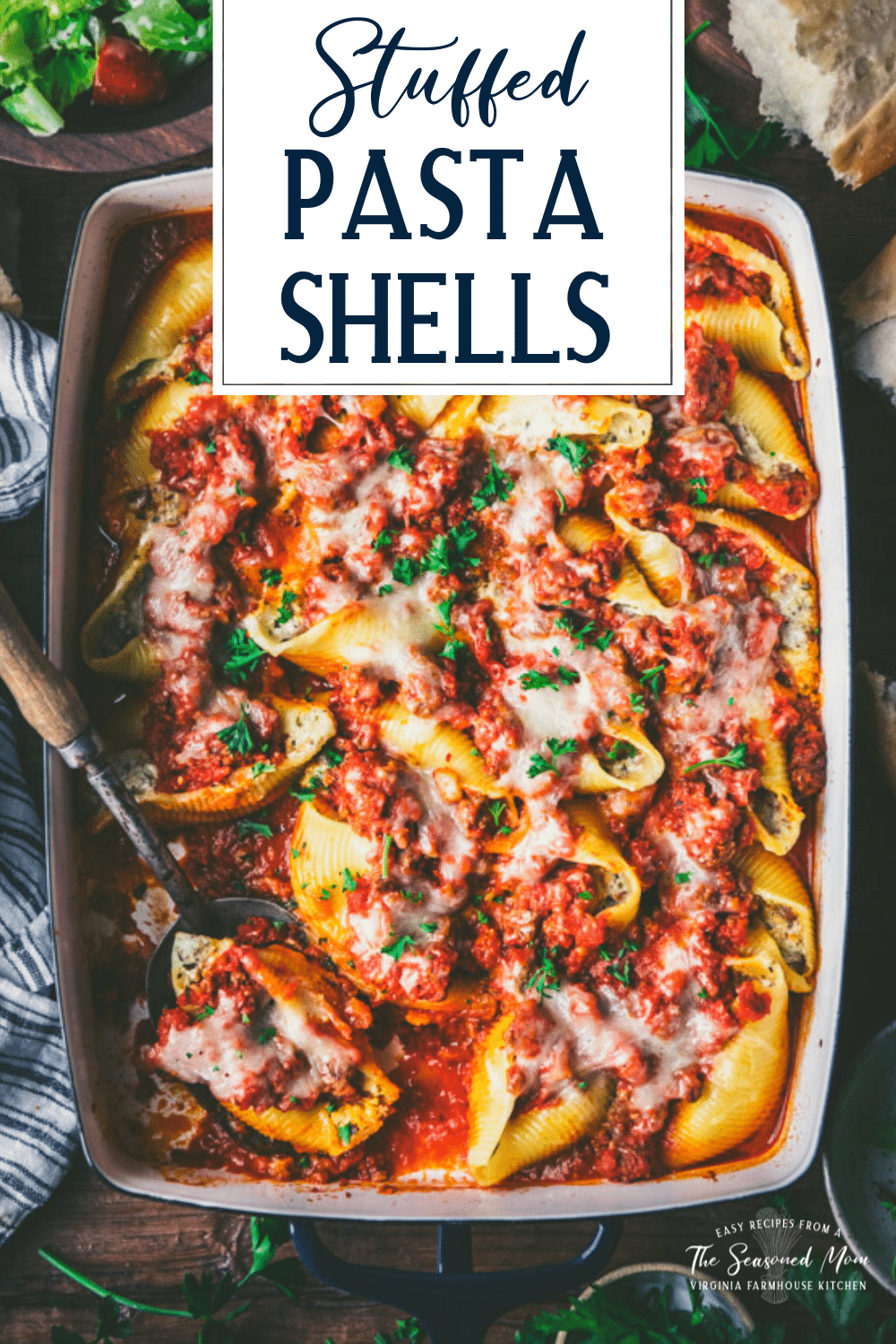 Serving spoon in a pan of easy stuffed pasta shells with text title overlay