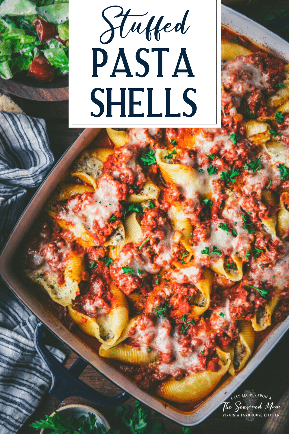 Overhead shot of a pan of ricotta stuffed shells with meat and text title overlay