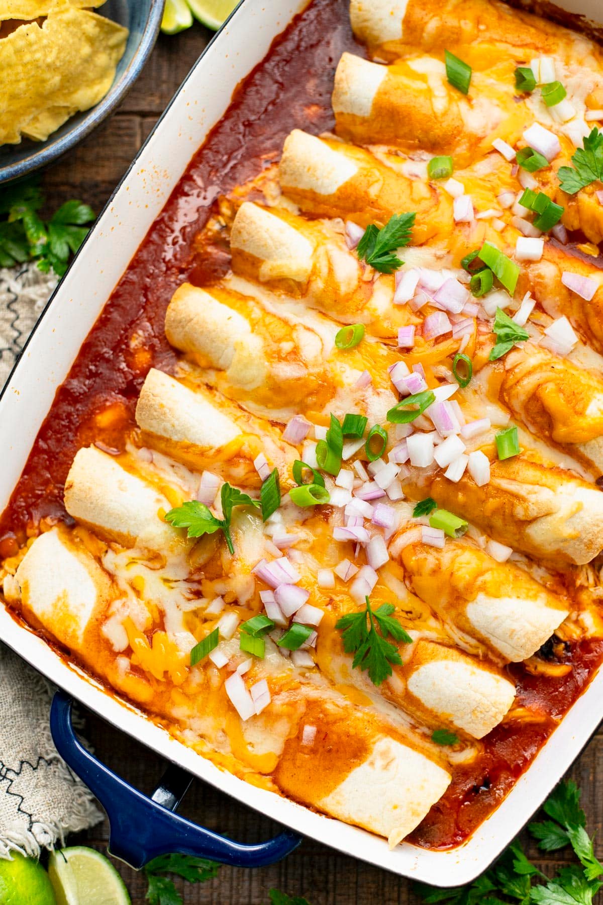 Overhead image of a pan of easy chicken enchiladas.