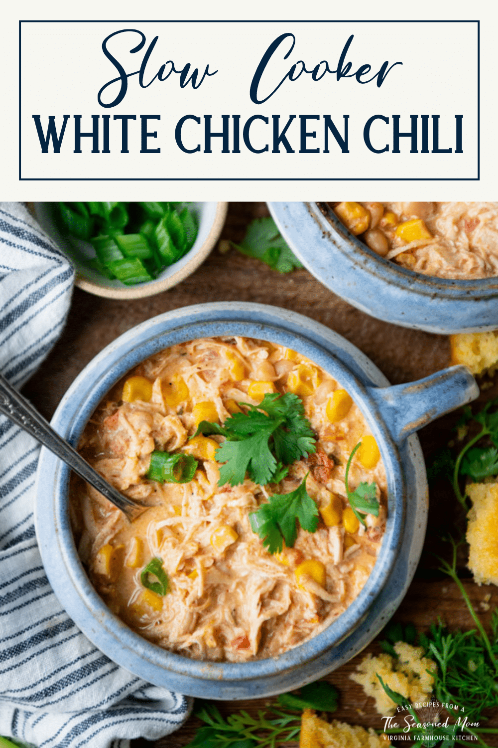 Close overhead image of a bowl of slow cooker cream cheese chicken chili with text title box at top