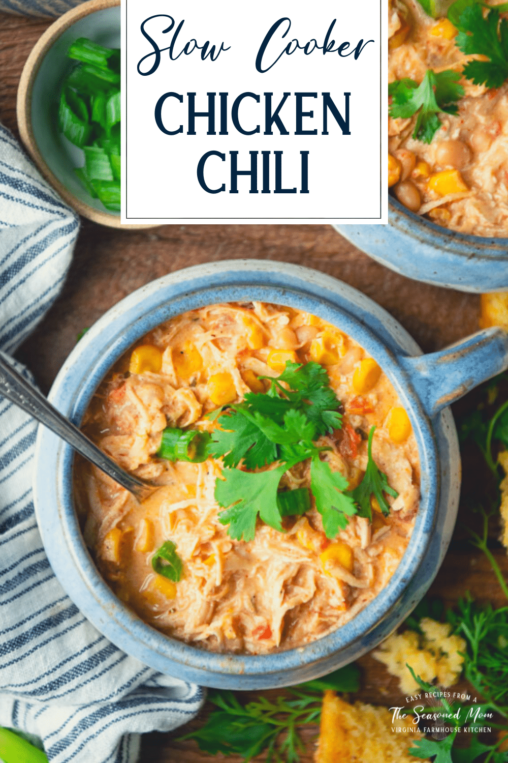 Close overhead image of a bowl of cream cheese chicken chili with text title overlay