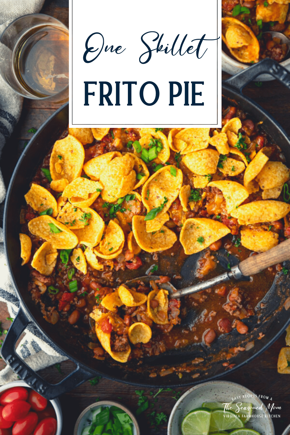 Close overhead image of a pan of frito pie chili cheese casserole with text title overlay