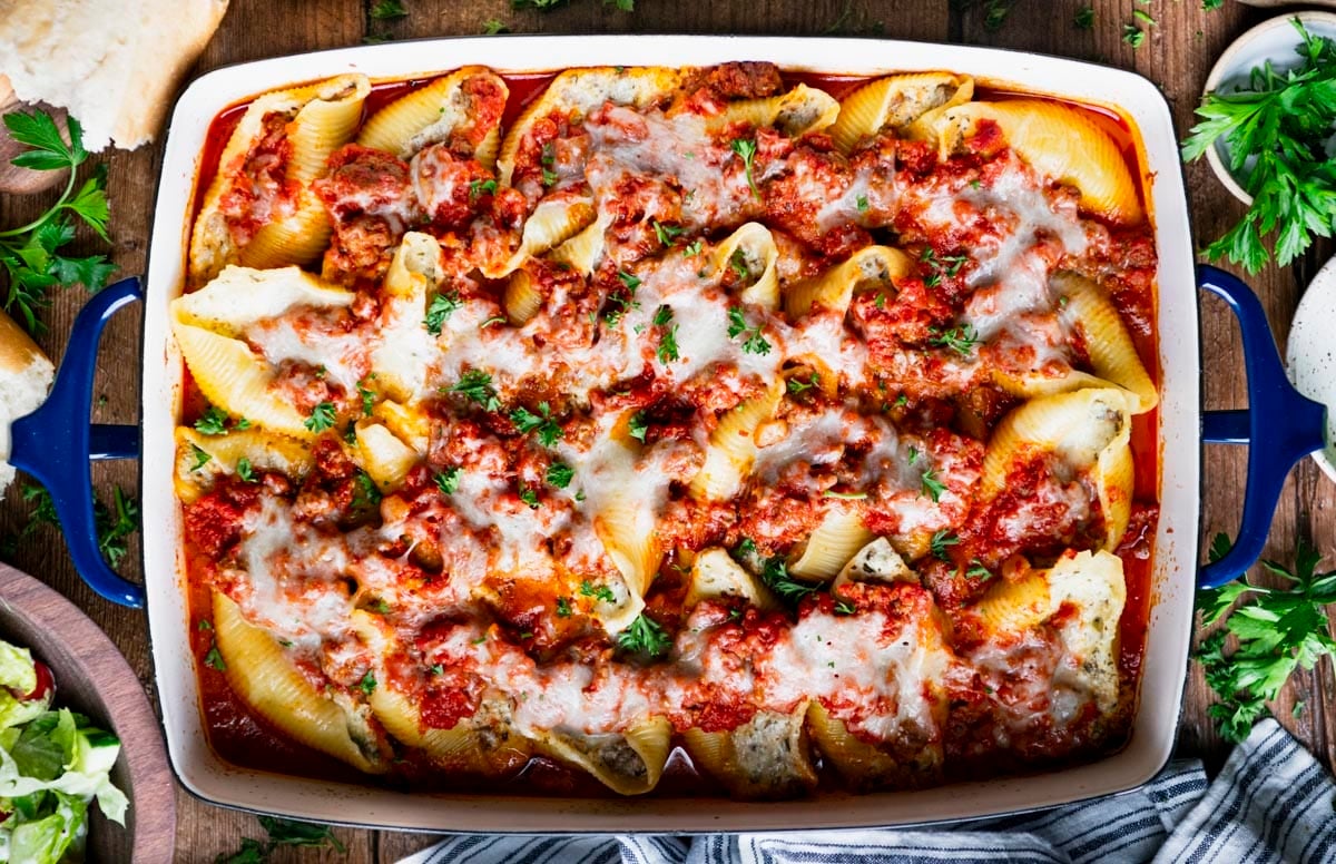 Horizontal overhead image of a pan of stuffed shells with meat.