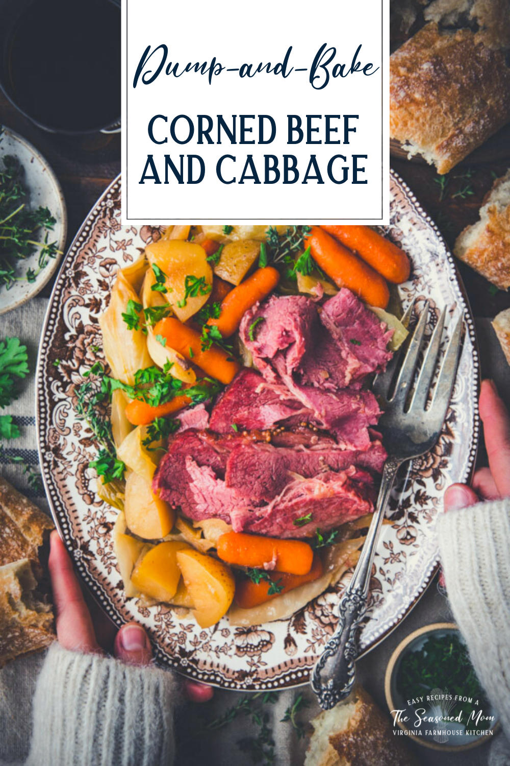 Overhead shot of hands holding a platter of corned beef and cabbage with text title overlay
