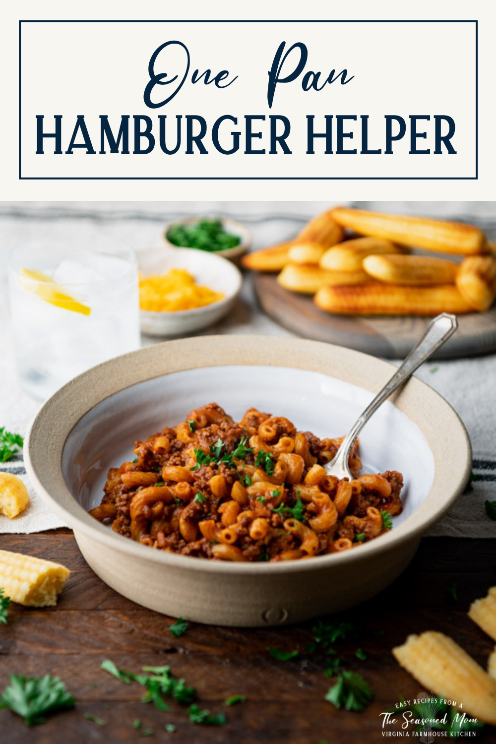 Side shot of a bowl of homemade hamburger helper with text title box at top.