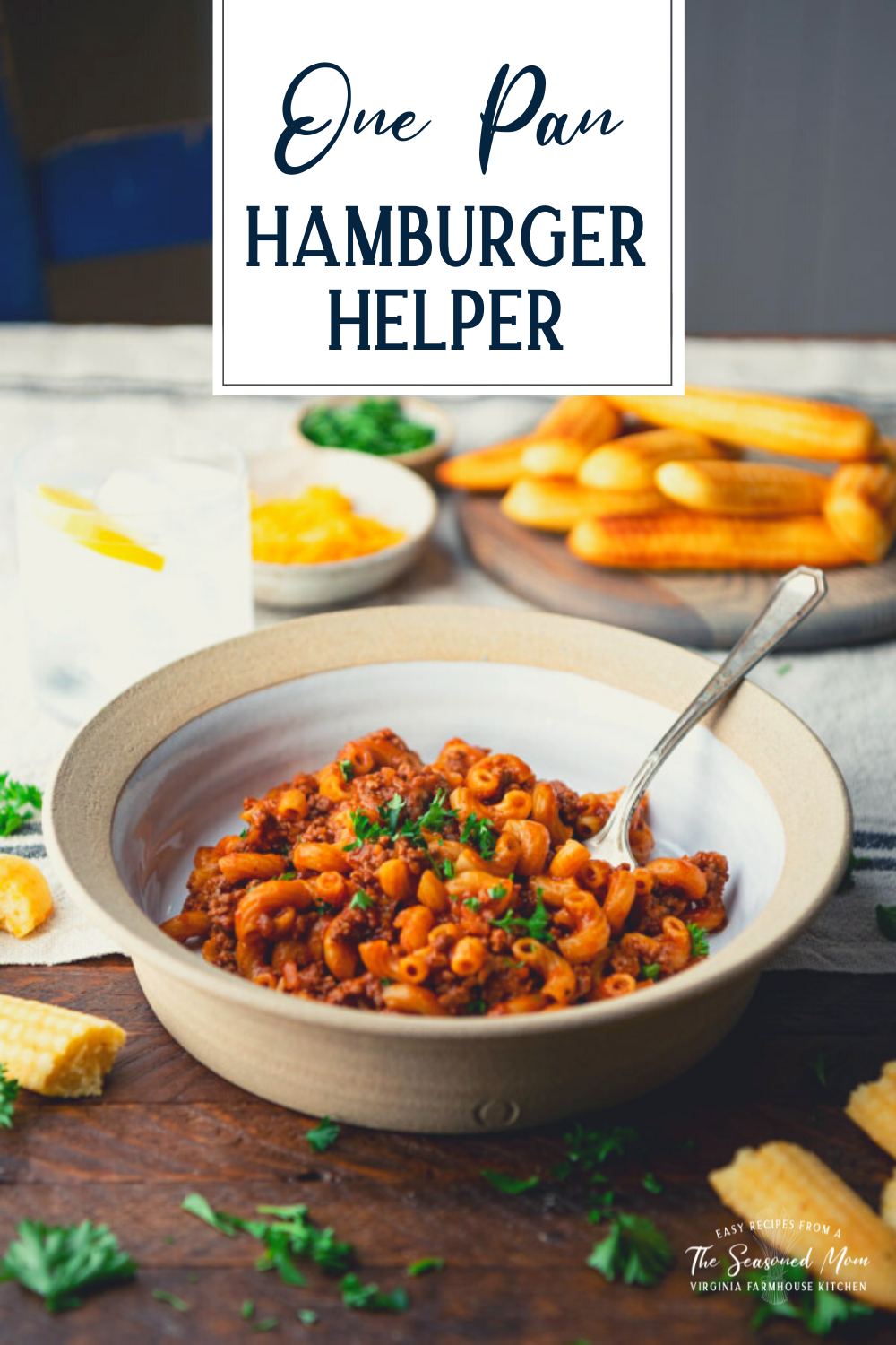 Side shot of homemade hamburger helper recipe served in a white bowl with text title overlay.