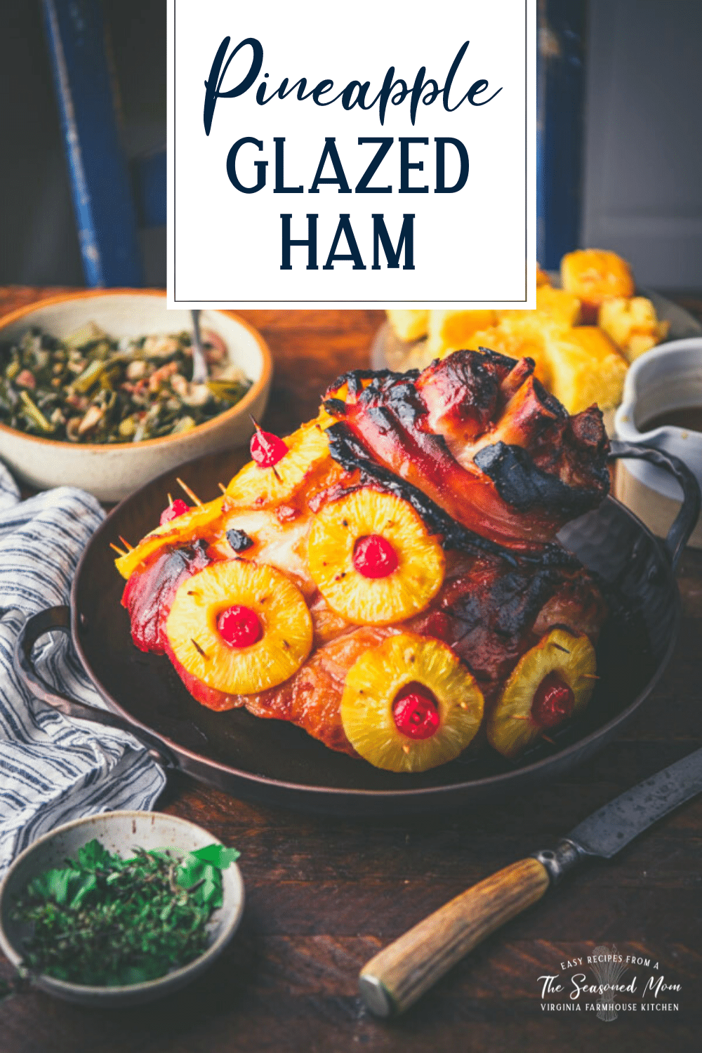 Pineapple ham in a roasting pan on a wooden dinner table with text title overlay.