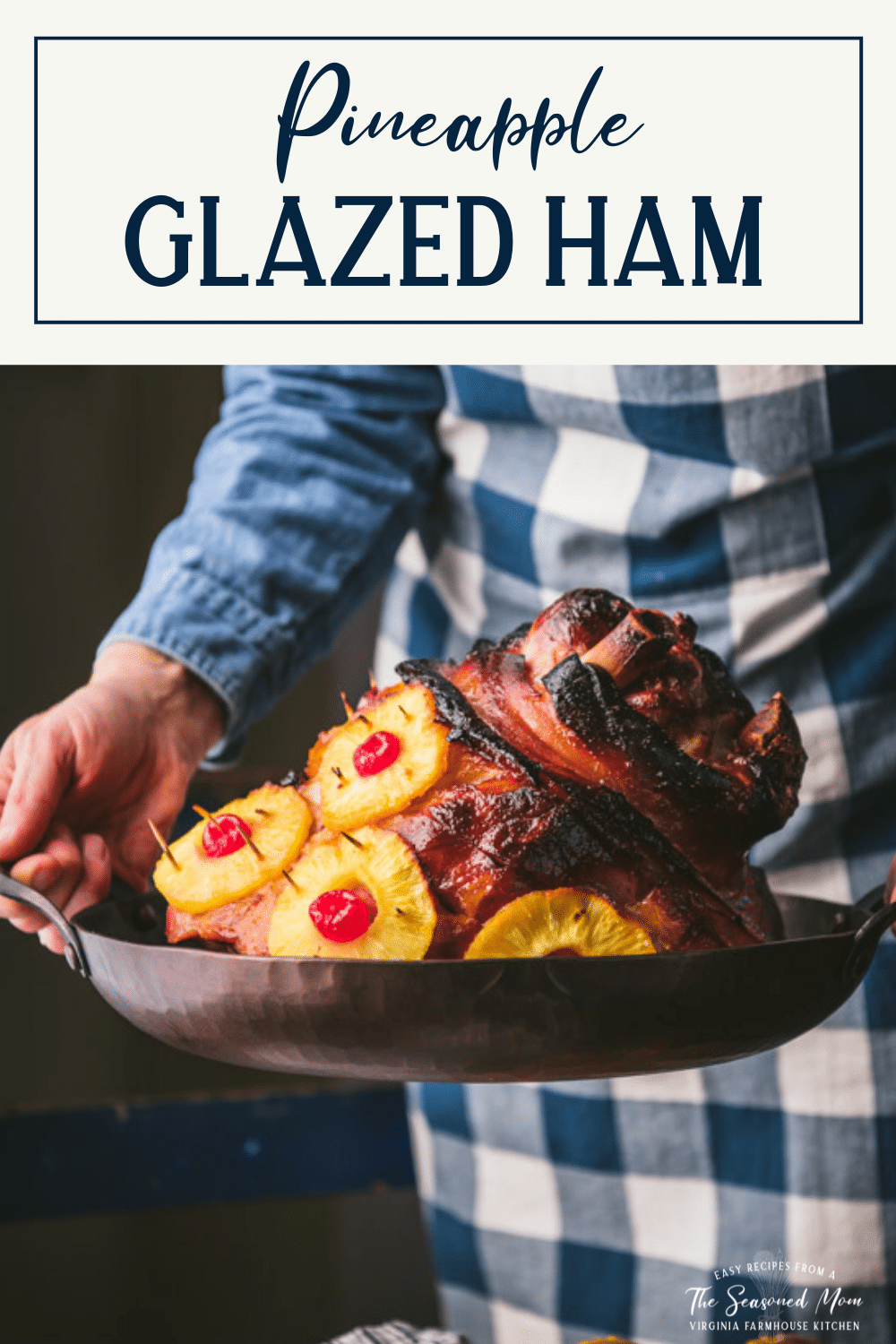 Hands holding a pineapple glazed ham in a roasting pan with text title box at top.