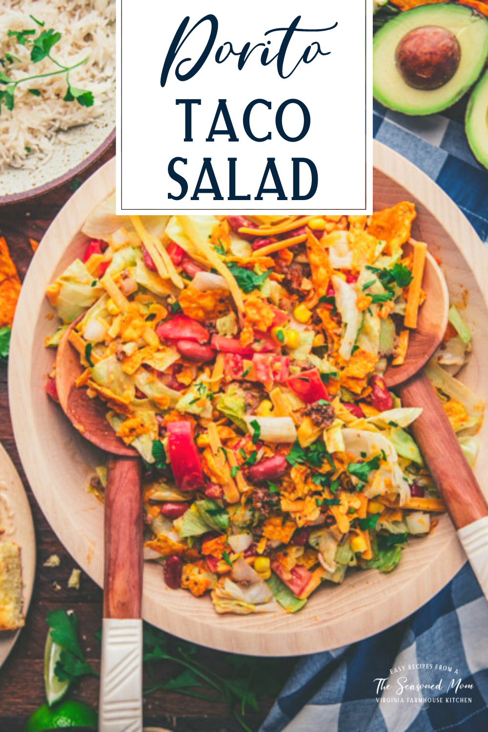 Wooden servers in a bowl of the best dorito taco salad recipe with text title overlay