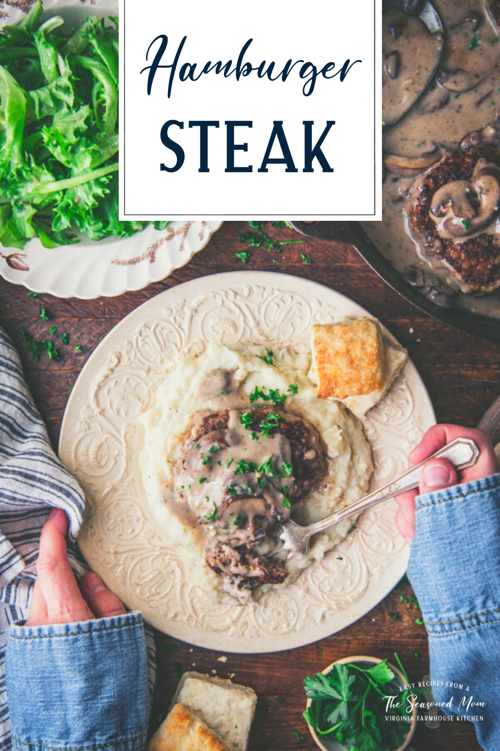 Overhead shot of hands eating a plate of mashed potatoes and hamburger steak with gravy and text title overlay