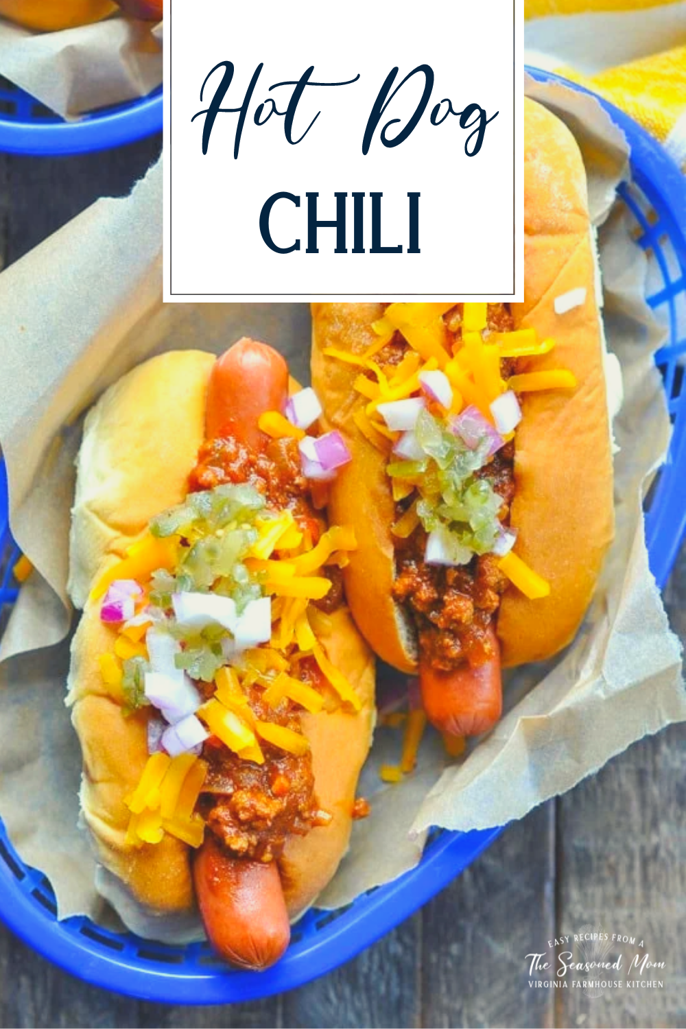Overhead shot of a basket of chili dogs with text title overlay