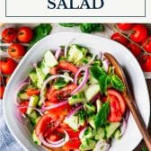 Cucumber tomato onion salad with text title box at top.