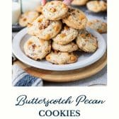 Plate of salted butterscotch cookies with pecans and text title at the bottom.
