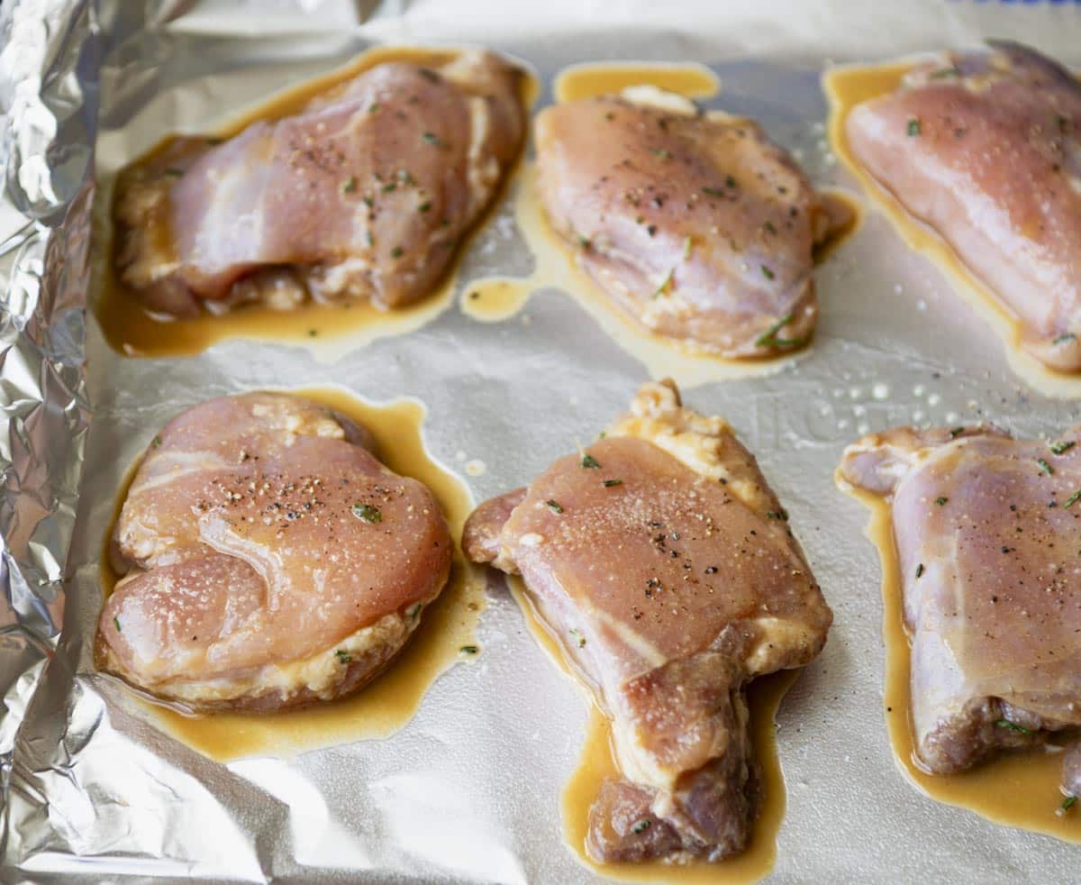 Process shot showing how to bake boneless skinless chicken thighs.