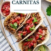 Dutch oven carnitas with text title overlay.