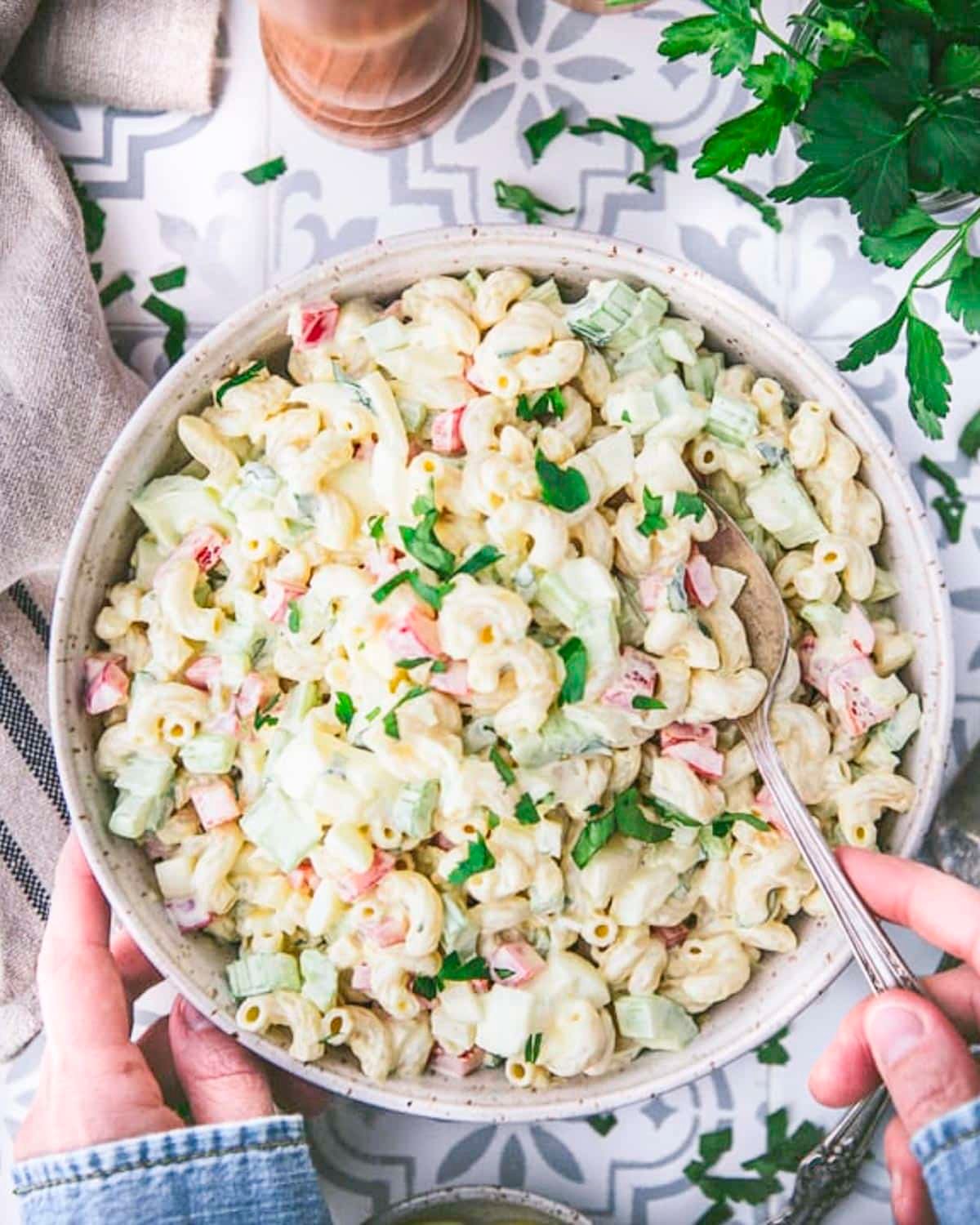 Overhead shot of old fashioned macaroni salad in a white bowl.