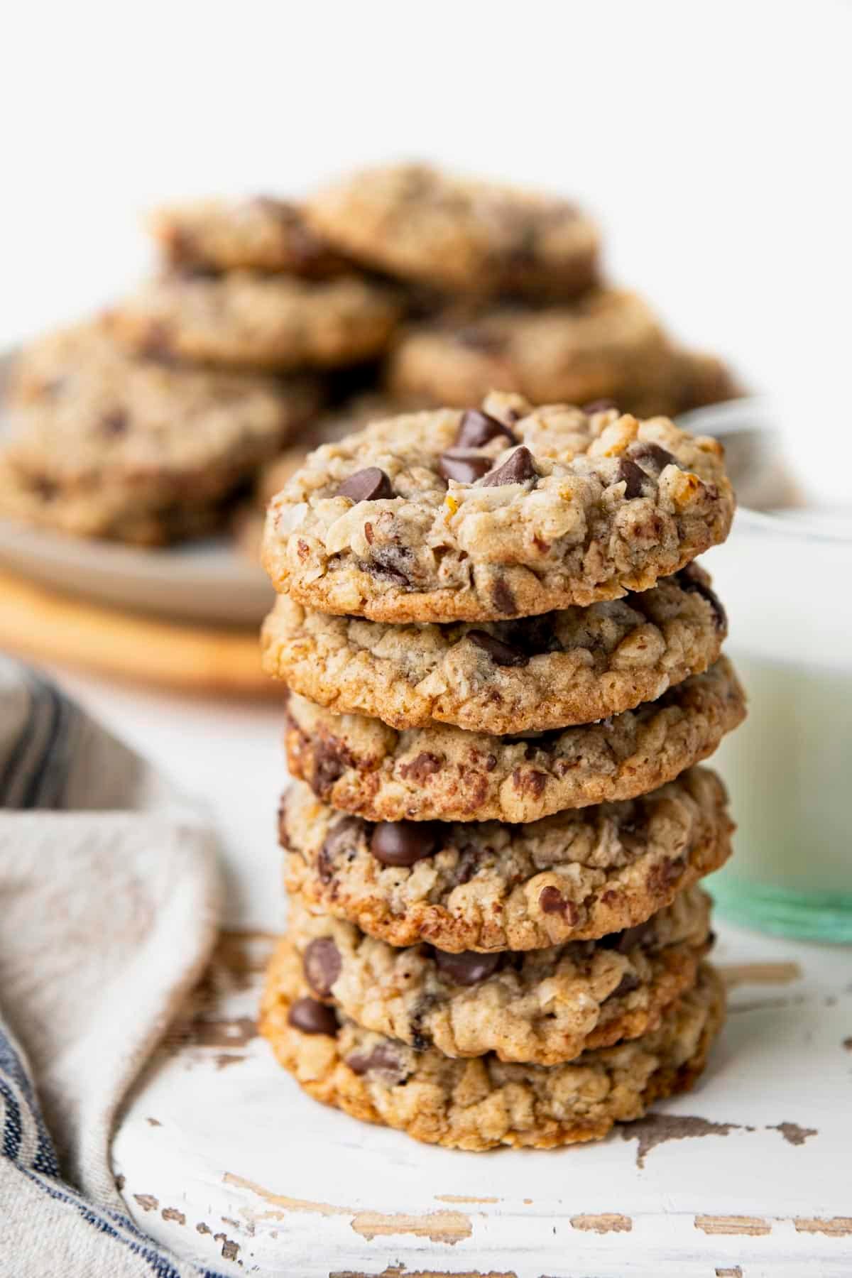 Close up side shot of the best kitchen sink cookie recipe stacked on a white table.